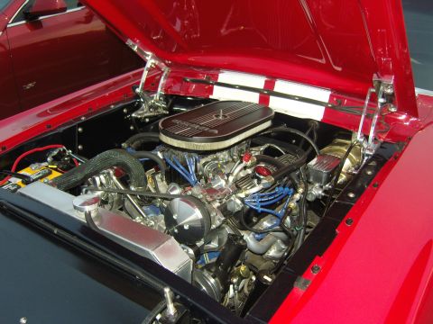 2007 Ford Mustang - A detailed view of a classic car's engine bay, a V8 engine and polished components.