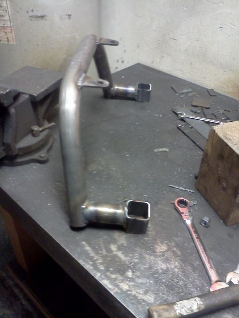 1999 Ford Ranger - Custom metal bracket on a workbench, possibly for a vehicle modification.