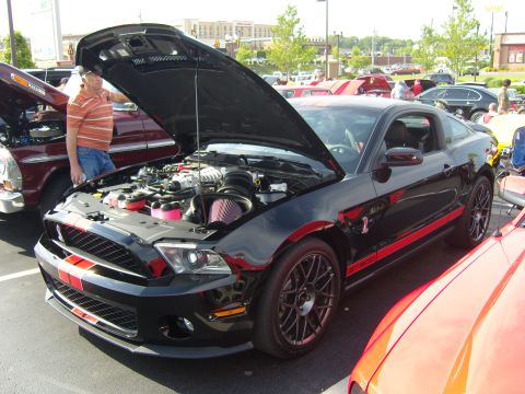 2007 Ford Mustang - 2007 Ford Mustang GT500 at a car show, hood open to display the engine and supercharger.