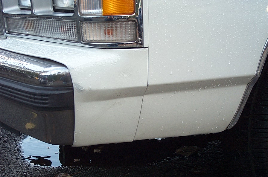 White 1991 Ford Crown Victoria LTD front corner with chrome bumper and amber turn signal