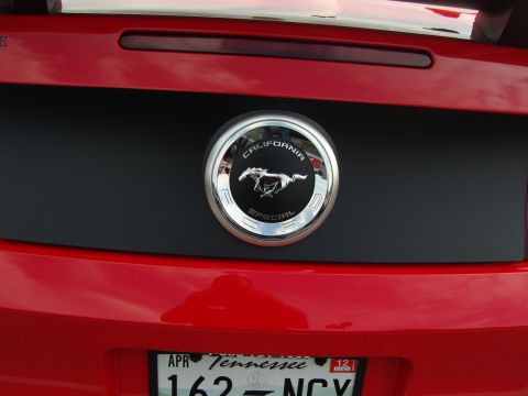 2007 Ford Mustang - Close-up of the rear of a red Ford Mustang, highlighting the California Special emblem and license plate.