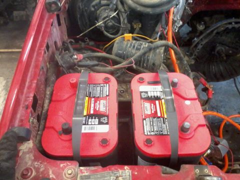 1995 Ford F-150 - Dual battery setup with Optima batteries, likely for increased power needs.