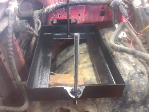 1995 Ford F-150 - Installing a dual battery tray with an isolator in a vehicle's engine bay.