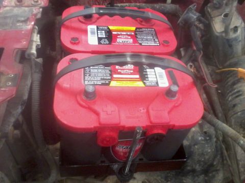 1995 Ford F-150 - Two Optima RedTop batteries are installed with an isolator in a vehicle's engine bay.