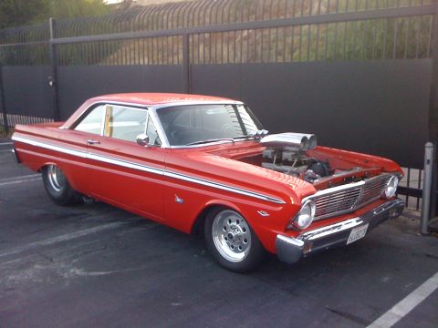 1964 Ford Ranchero - A modified 1964 Ford Falcon coupe displays its prominent supercharger under the open hood.