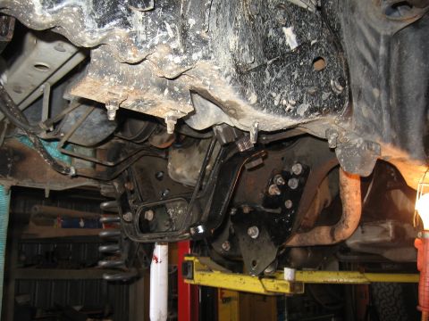1994 Ford Bronco - Undercarriage view of a 1994 Ford Bronco, focusing on suspension and frame details.