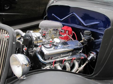 2006 BMW 5 Series - Close-up of a polished Chevrolet V8 engine, chrome components and a prominent air filter.