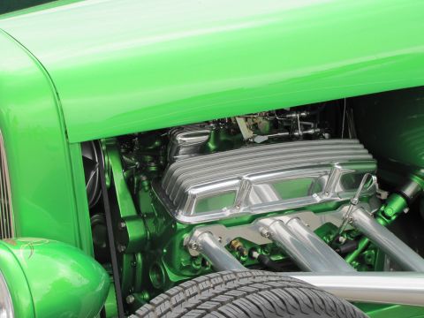 2006 BMW 5 Series - Custom V8 engine with chrome valve covers and green block, part of a hot rod.