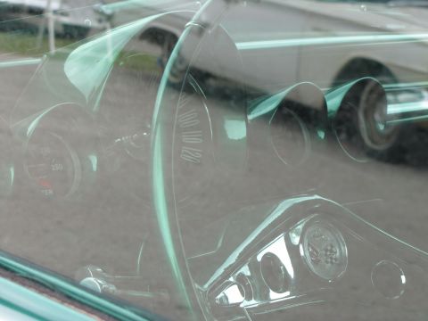 2006 BMW 5 Series - View of the dashboard interior, multiple gauges and chrome accents.
