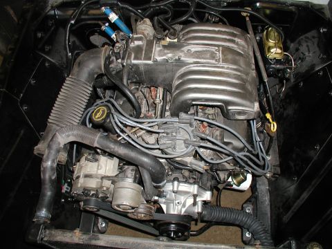 1960 Ford Ranchero - Close-up view of a vehicle's engine bay, showing various components and wiring.