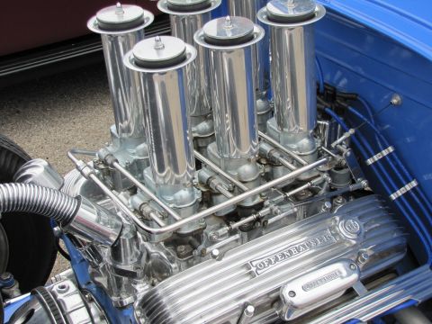 2006 BMW 5 Series - Close-up of a polished V8 engine with prominent Offenhauser branding and chrome components.