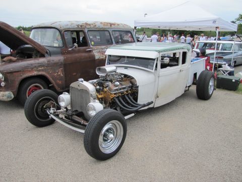 2006 BMW 5 Series - Custom hot rod pickup truck with a powerful V8 engine and a rusty vintage SUV in the background.