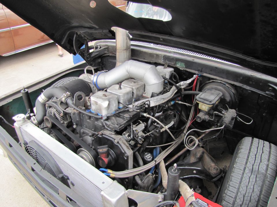 Engine bay with large turbocharger and intercooler piping