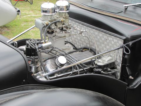 2006 BMW 5 Series - Close-up view of a custom V8 engine bay with prominent dual carburetors and chrome accents.