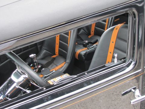 2006 BMW 5 Series - Custom interior with racing seats and harnesses visible through the window.