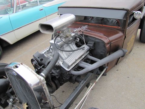 2006 BMW 5 Series - Custom hot rod features a prominent engine with a large air intake scoop and side exhaust pipes, parked next to another vehicle.