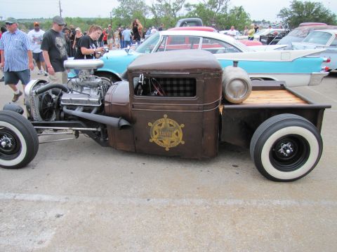 2006 BMW 5 Series - Custom rat rod pickup truck with a prominent V8 engine and sheriff star emblem.
