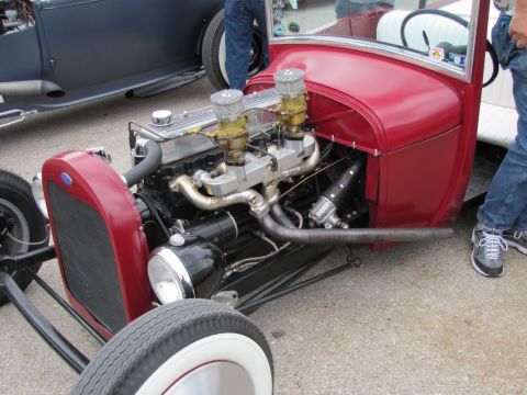 2006 BMW 5 Series - Close-up of a hot rod's engine and front end, with another vehicle visible to the left.