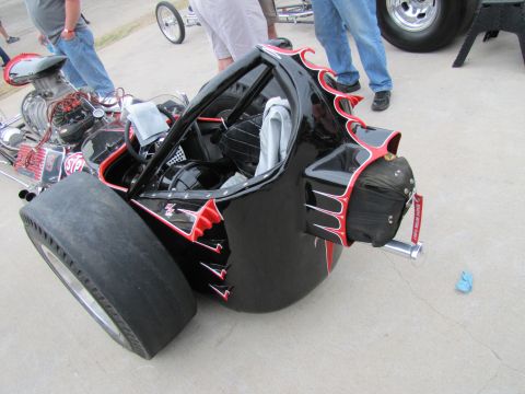 2006 BMW 5 Series - Custom dragster with flame graphics and exposed engine components.