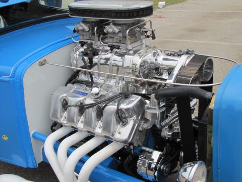 2006 BMW 5 Series - A highly polished V8 engine with a prominent supercharger and dual carburetors is visible in this custom build.