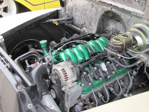 2006 BMW 5 Series - Close-up view of a modified engine bay, showing custom paint and components.