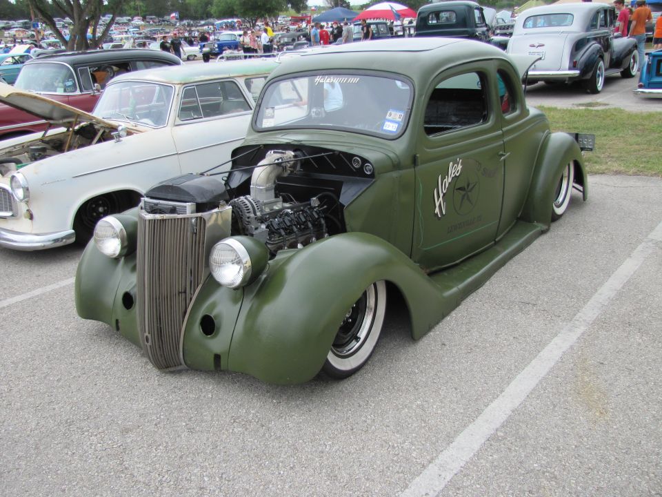 Green hot rod coupe with exposed engine and custom "Hale's" lettering