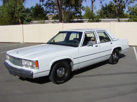1991 Ford LTD Crown Victoria - This 1991 Ford Crown Victoria LTD is captured in a three-quarter front view, its classic sedan body style.