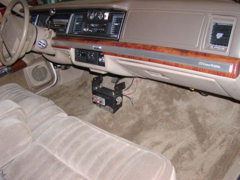 1991 Ford LTD Crown Victoria - The interior of a 1991 Ford Crown Victoria LTD, wood trim and plush seating.
