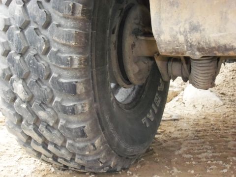 1989 Ford Bronco - Detail of an off-road tire and suspension system, likely from a truck or SUV.