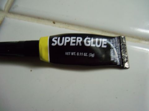 1968 Ford Bronco - A tube of Super Glue is shown, with its net weight of 0.11 oz (3g) clearly printed on the packaging.