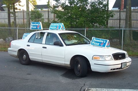 2001 Ford Crown Victoria - White 2001 Ford Crown Victoria used as a Domino's Pizza delivery vehicle.