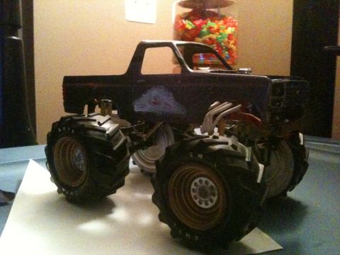 1979 Ford Bronco - Model of a monster truck with oversized tires and visible engine components, likely a custom build.