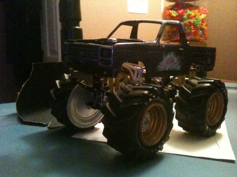 1979 Ford Bronco - This model truck features oversized tires and a lifted suspension, suggesting it's built for off-road performance.