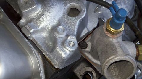 1978 Ford Bronco - Engine component detail shot, likely a thermostat housing or water pump connection.