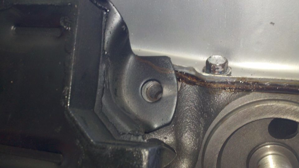 Close-up of engine component with bolt and gasket