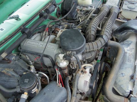 1968 Ford Bronco - Close-up view of a Ford 5.0L engine, showing various components and wiring.