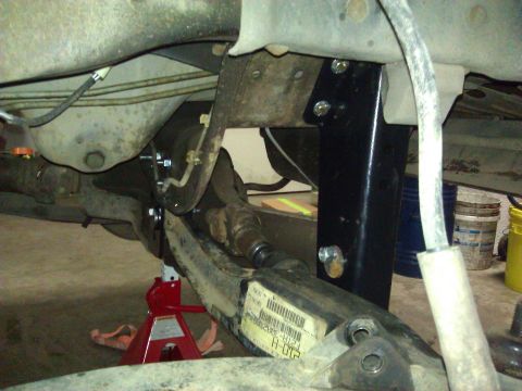 1992 Ford F-150 - Undercarriage view of a truck's suspension system, possibly undergoing repairs or modifications.