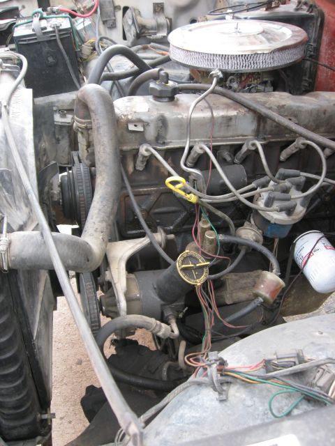 1981 Ford Bronco - Close-up view of a vehicle's engine compartment, showing various mechanical components and wiring.