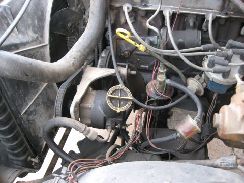 1981 Ford Bronco - Close-up view of an engine bay, showing various mechanical components and wiring.