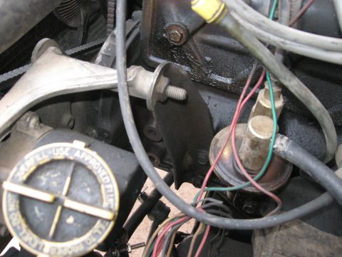 1981 Ford Bronco - Close-up view of an engine bay, focusing on a brake fluid reservoir cap with instructions.