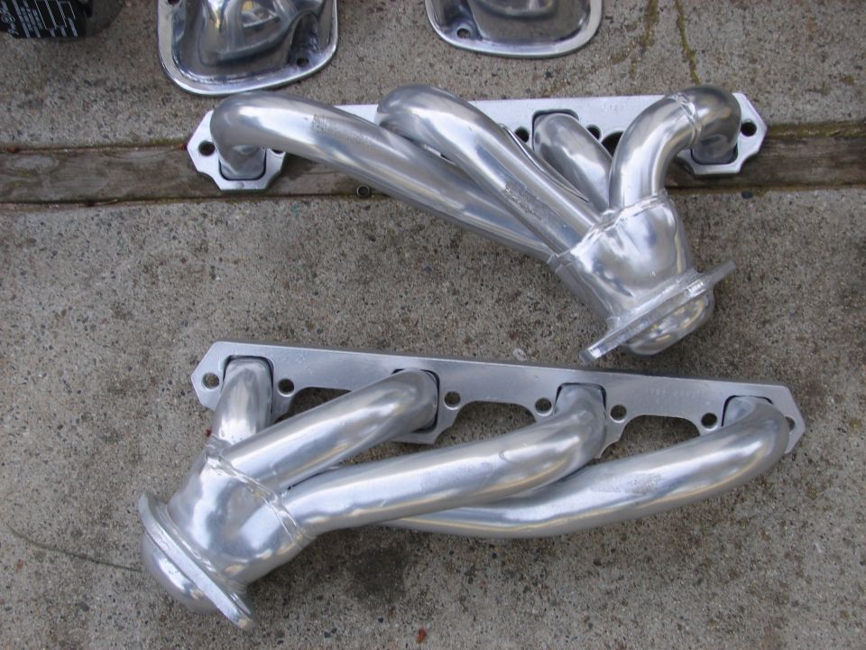 two polished aluminum exhaust headers