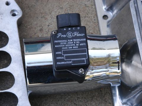 1973 Ford Ranchero - A Pro-Flow mass air flow sensor is attached to a chrome intake tube, with surrounding metal components.