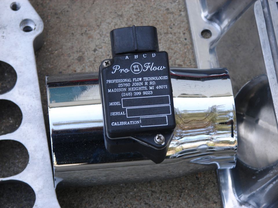 Pro-Flow mass air flow sensor mounted on chrome tubing, with metal bracketry