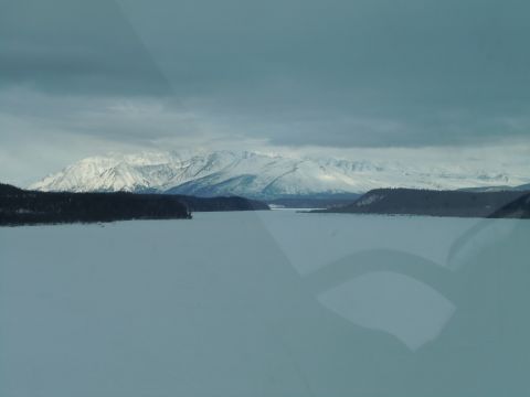 2009 Kenworth T800 - Winter landscape with snow-covered mountains and a frozen body of water.