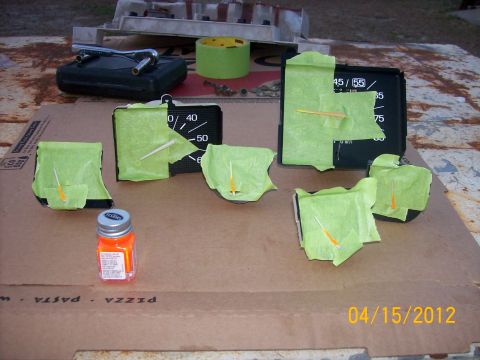 1982 Ford F-100 - Gauges are prepped for restoration with masking tape and orange paint is ready.
