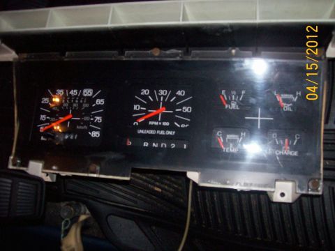 1982 Ford F-100 - The vehicle's dashboard gauges are shown, including the speedometer, tachometer, and fuel, oil, temperature, and charge indicators.