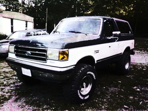 1989 Ford Bronco - This lifted 1989 Ford Bronco is shown from a three-quarter front view.