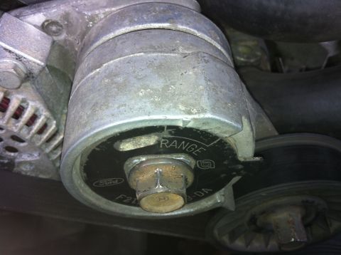 1992 Ford F-150 - Close-up of a Ford alternator pulley, showing the 'RANGE' adjustment indicator and part number F218-3-DA.