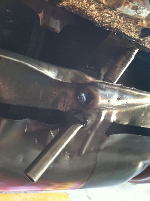 1967 Pontiac Grand Prix - Undercarriage shot showing a bent exhaust pipe and associated metalwork.