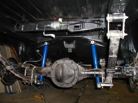 1960 Ford Ranchero - Undercarriage view of a 1960 Ford Ranchero, showing the rear axle and suspension components.